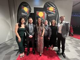 Ochre Dawn team wearing formal attire at NAIDOC gala ball